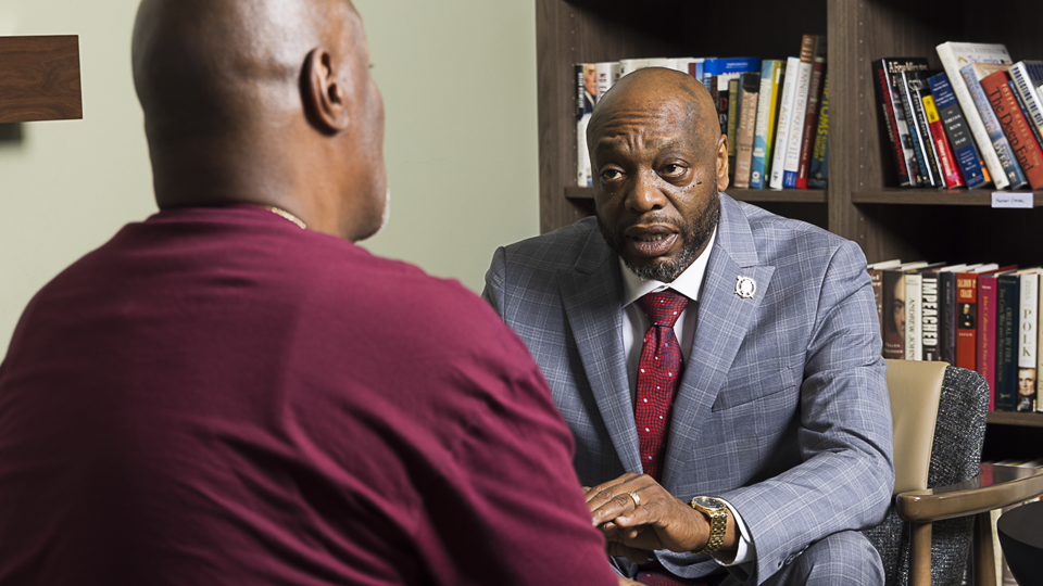 Kenneth telling his story in a one on one