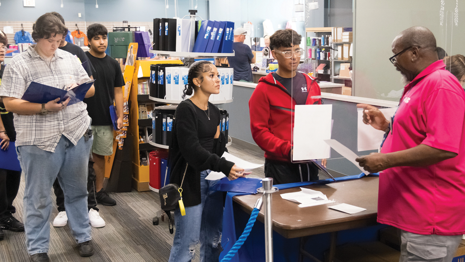 Students getting supplies