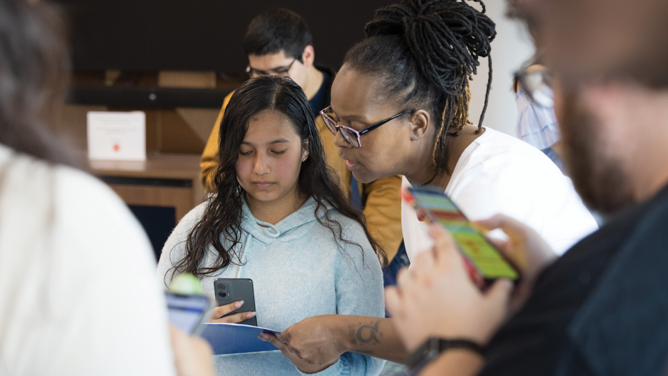 Teacher explaining something to student 