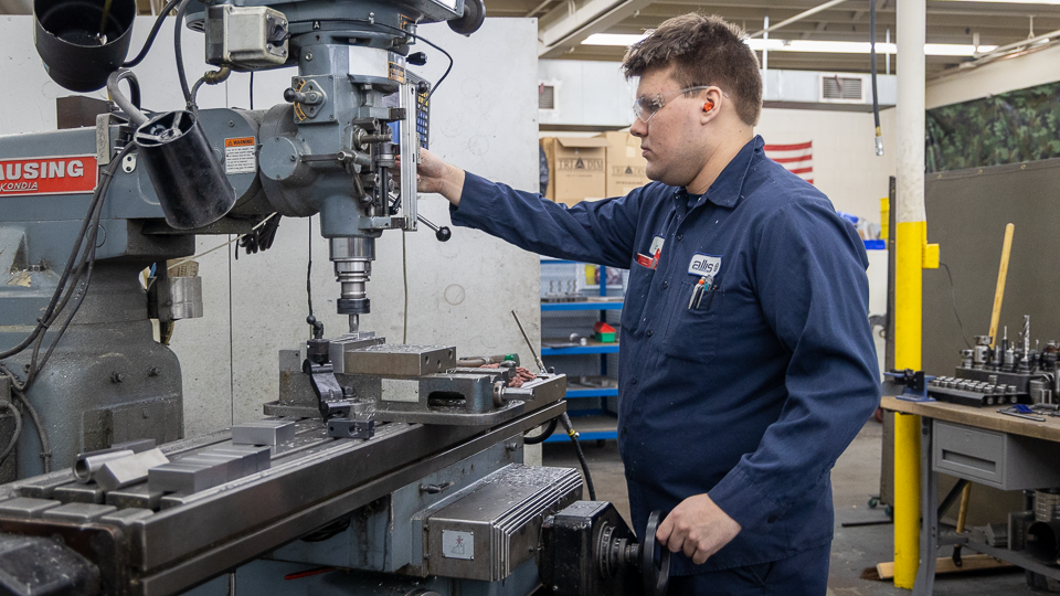 UAA student Eric Gama at work at Allis Manufacturing, a UAA partner.