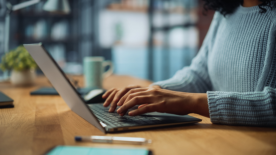 image of hands on a laptop