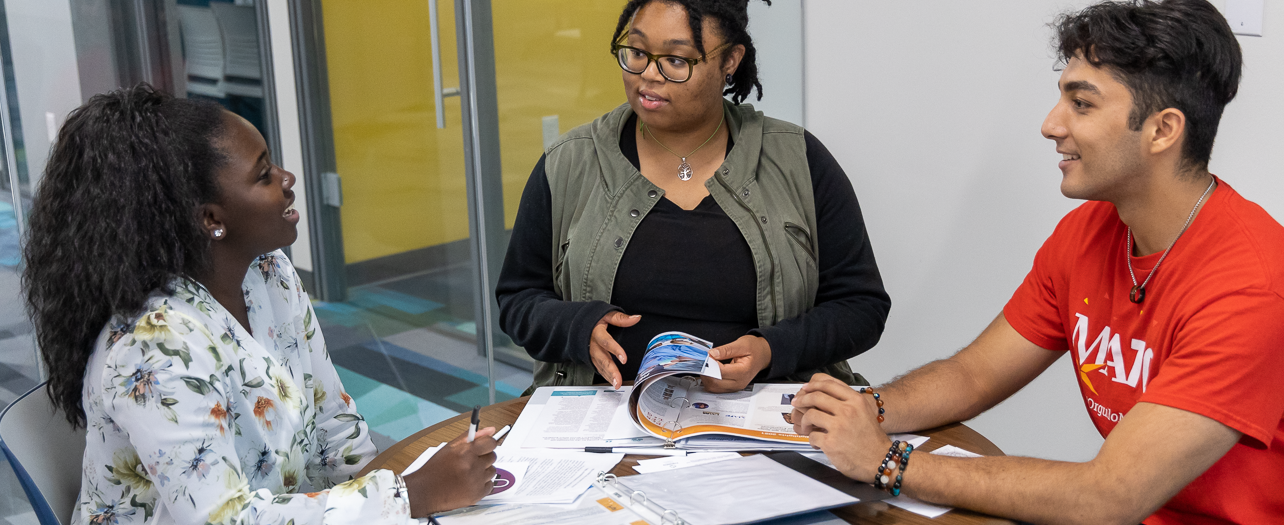 HS Students and MATC employee at a table