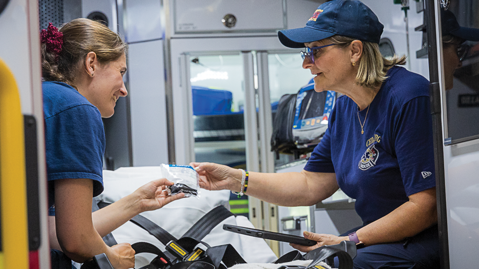 Melissa Demczak and her mother, Denisa (opposite), suit up (bottom left) and check supplies (bottom right).