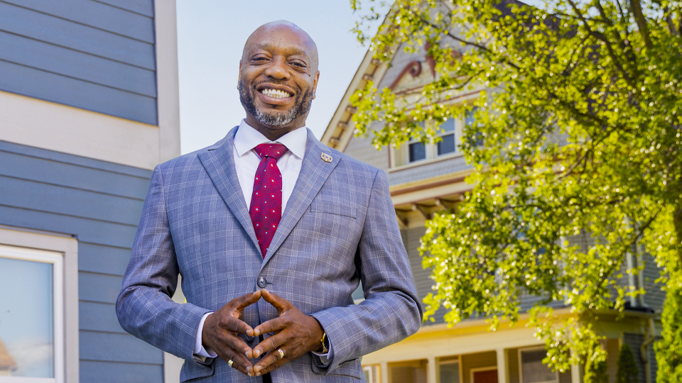 Kenneth posed outside a house